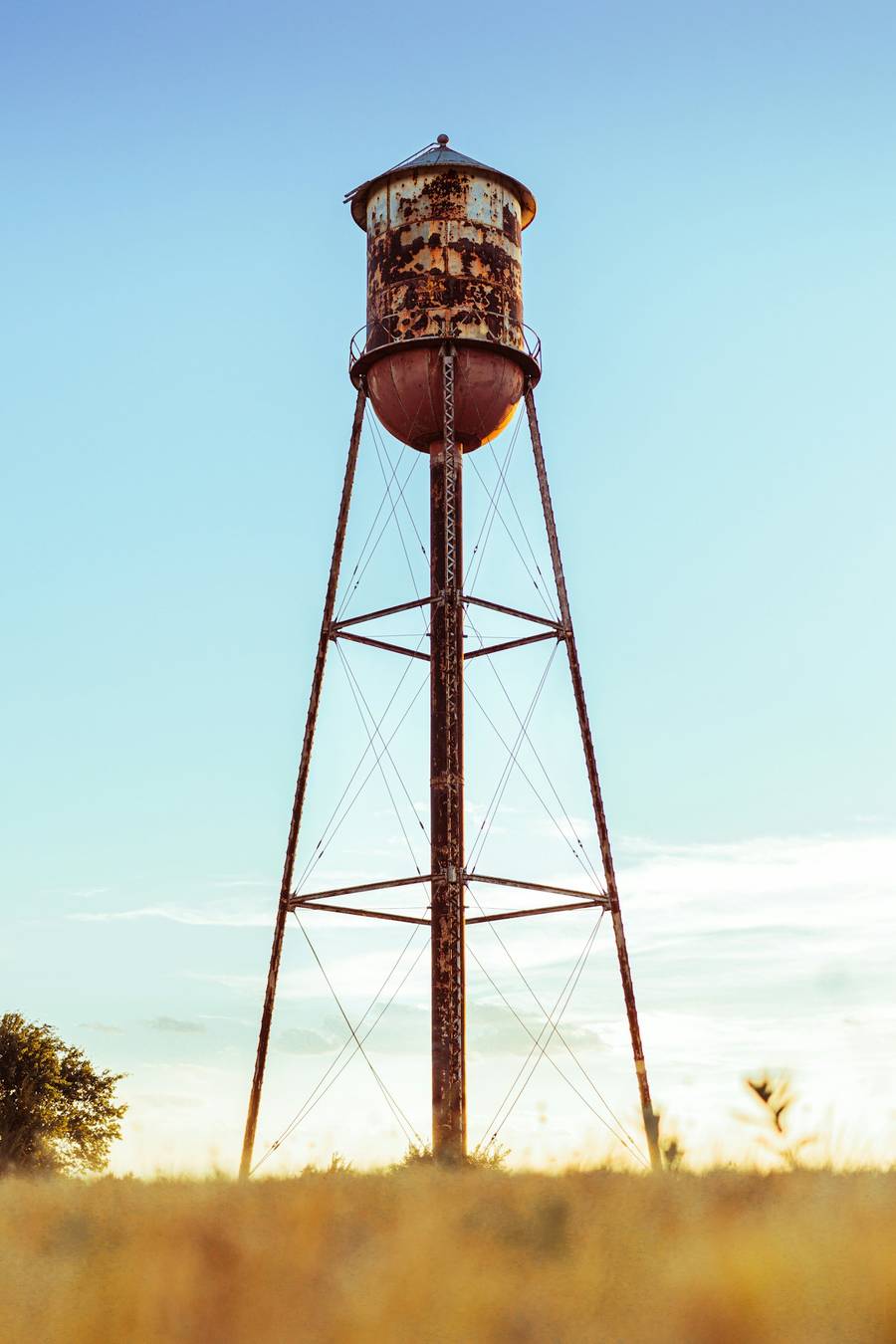 A water tower above open fields